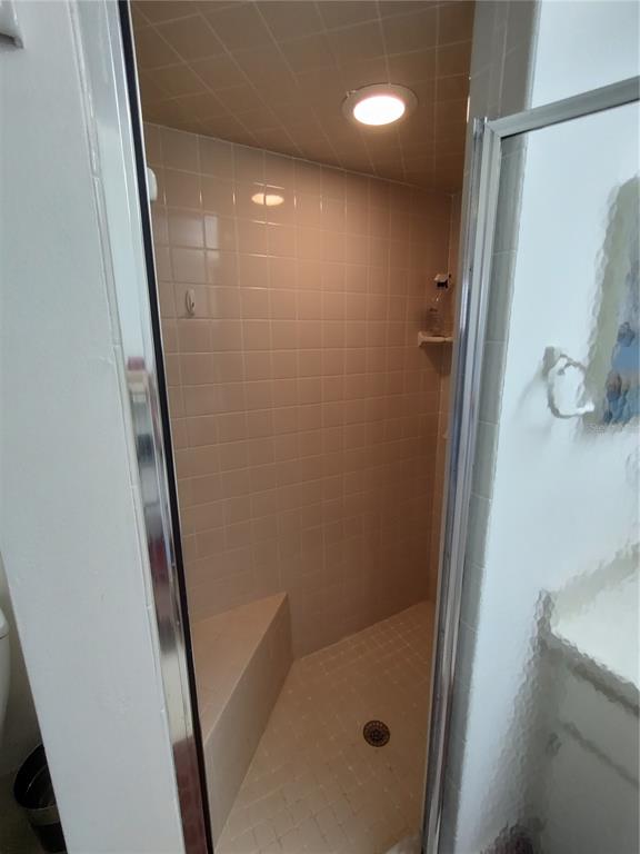 8274 Southwest 116th Street Ocala, FL 34481 - Photo 24 of 30 a bathroom with a shower and a mirror