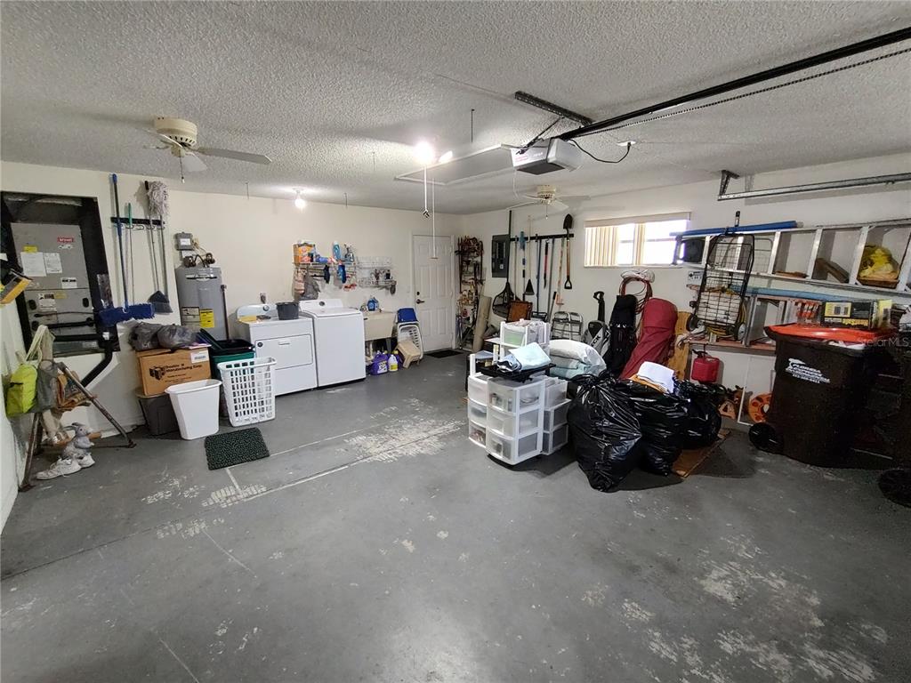 8274 Southwest 116th Street Ocala, FL 34481 - Photo 29 of 30 a living room with lots of furniture and clutter