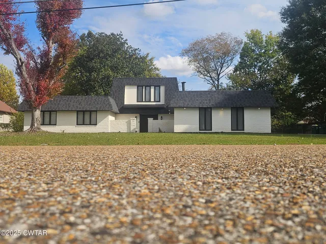 a house with trees in the background