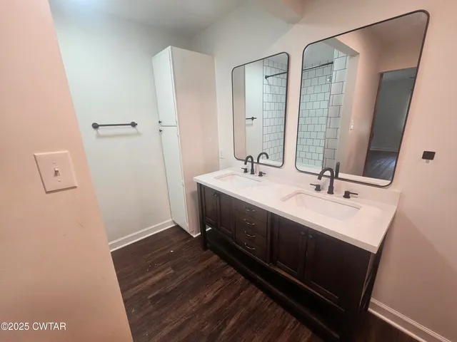 a bathroom with a sink and a mirror