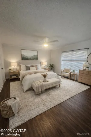 a view of an empty room and wooden floor