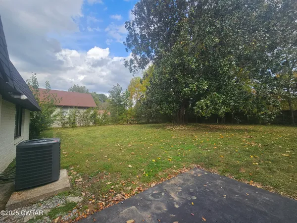 a view of outdoor space with deck and yard