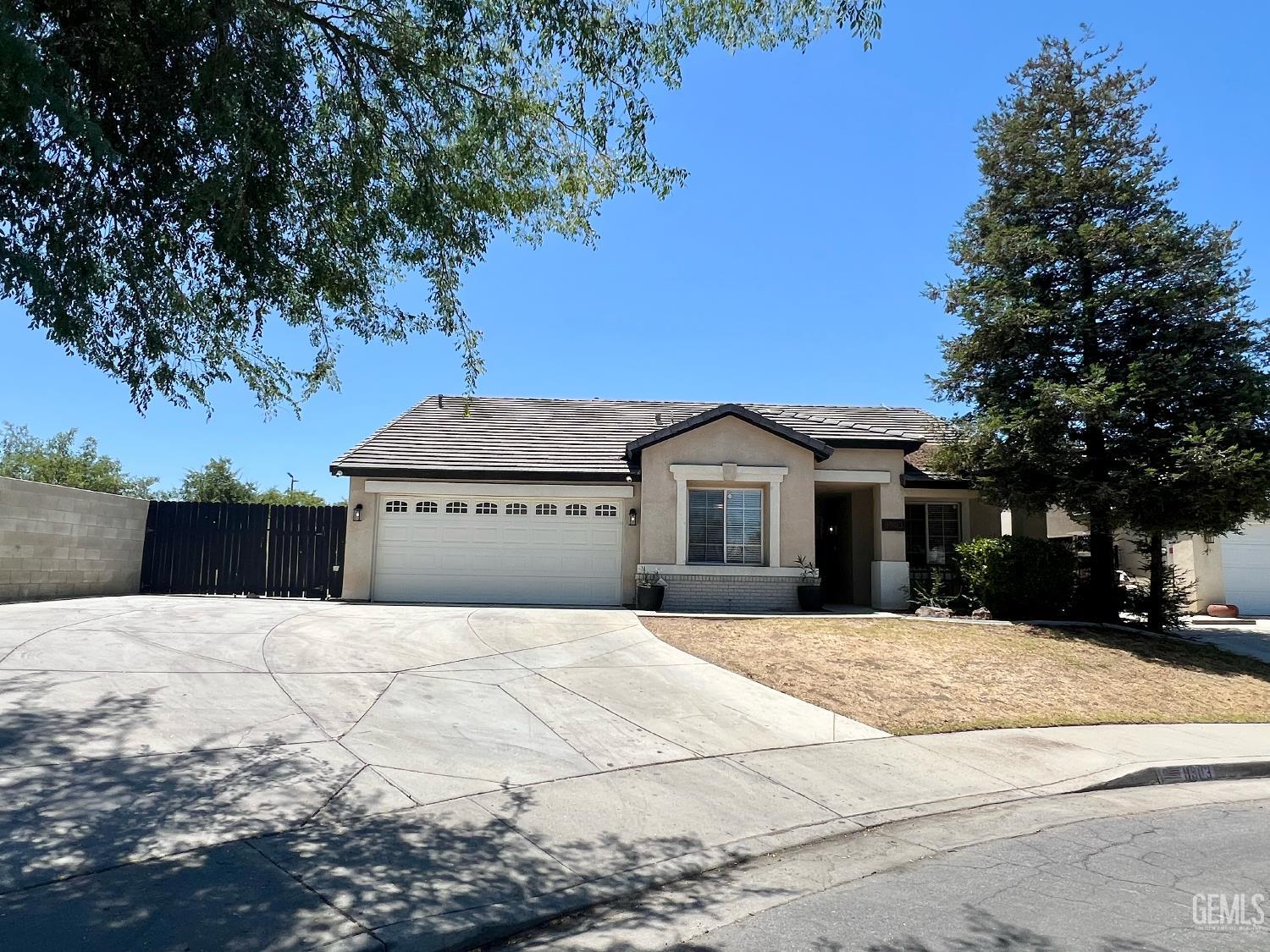 Undisclosed Address Bakersfield, CA 93312 - Photo 1 of 26 a front view of a house with a yard