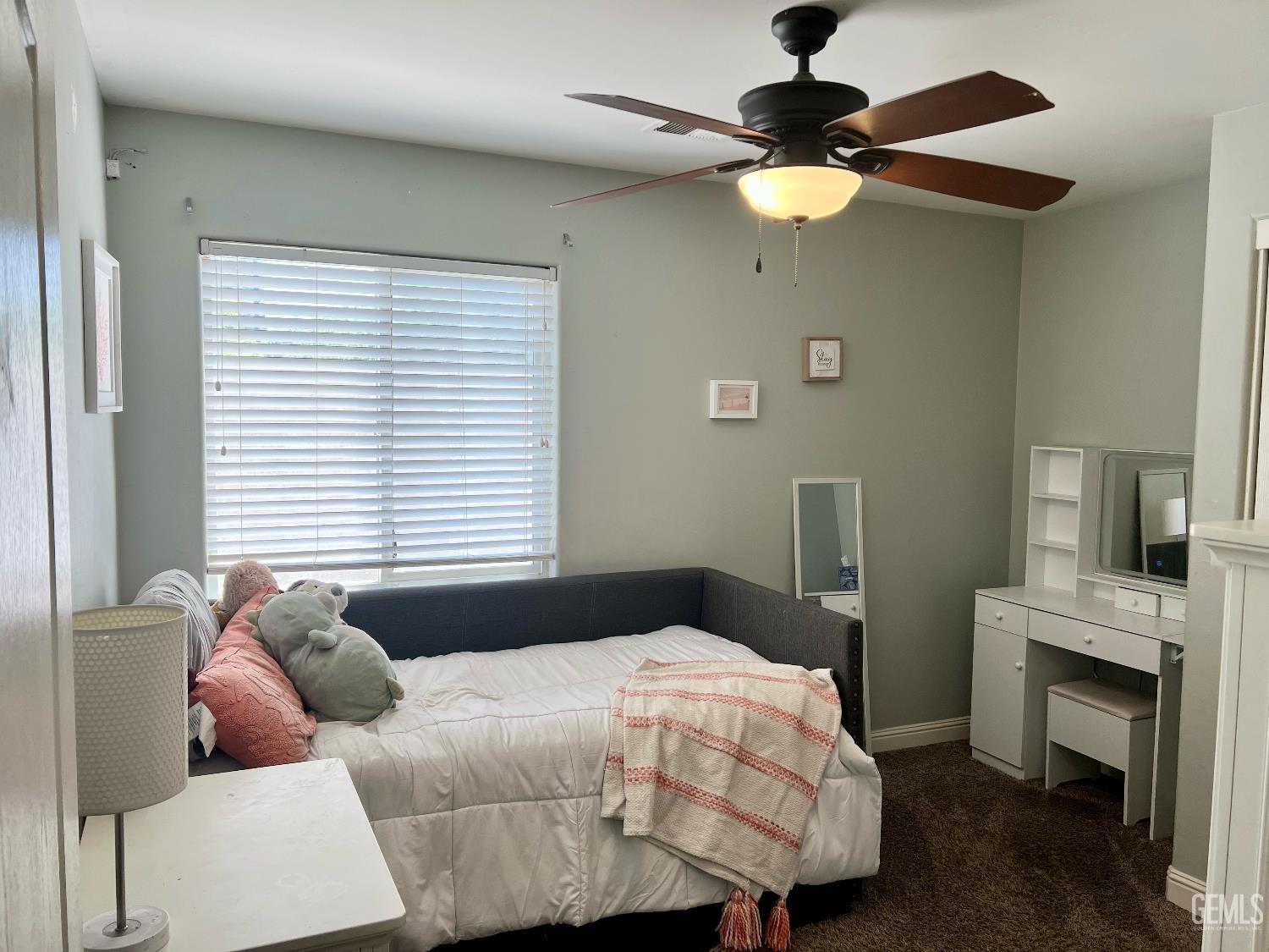 Undisclosed Address Bakersfield, CA 93312 - Photo 17 of 26 a bedroom with a bed and a chandelier