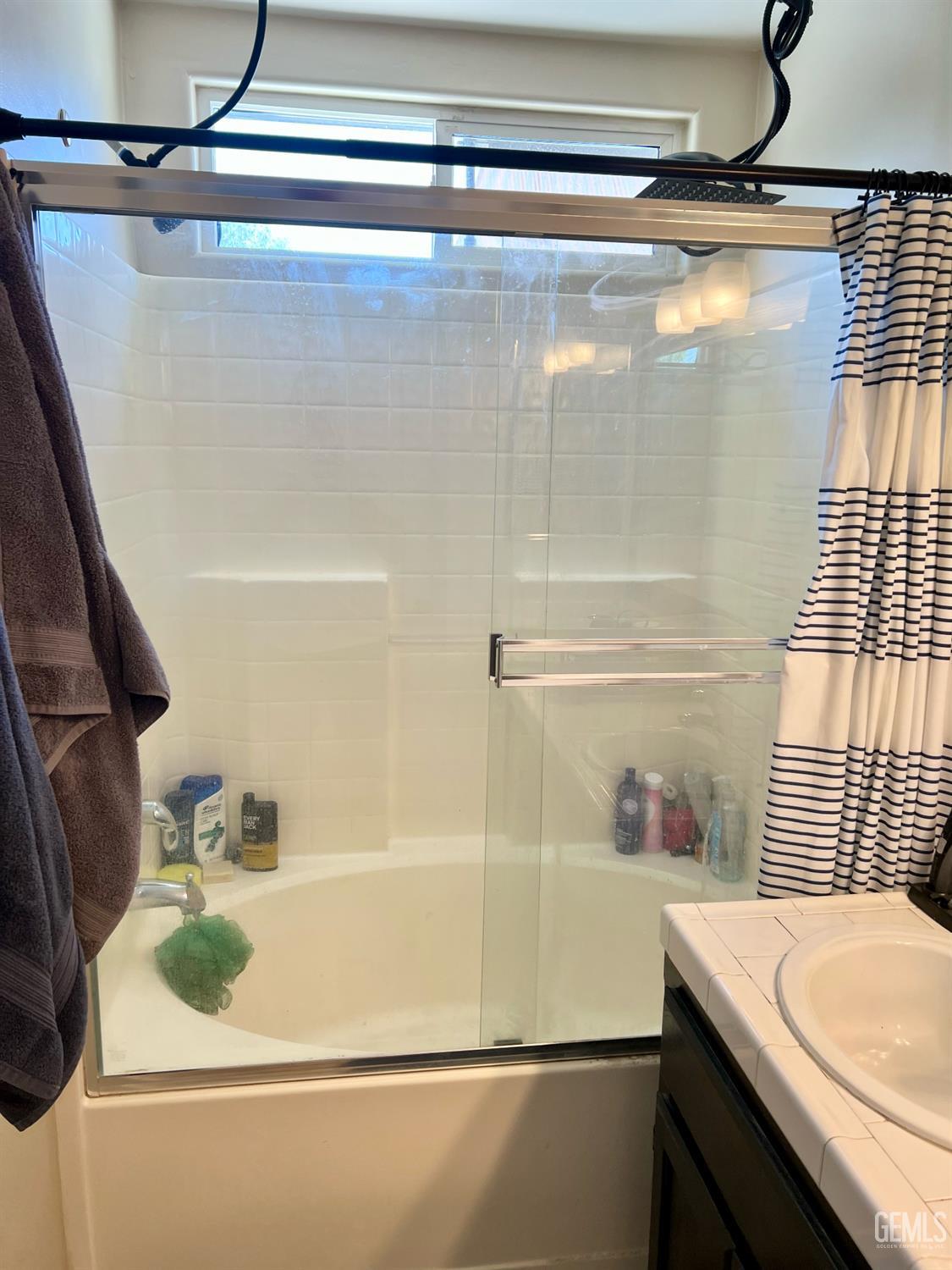 Undisclosed Address Bakersfield, CA 93312 - Photo 20 of 26 a bathroom with a sink and mirror