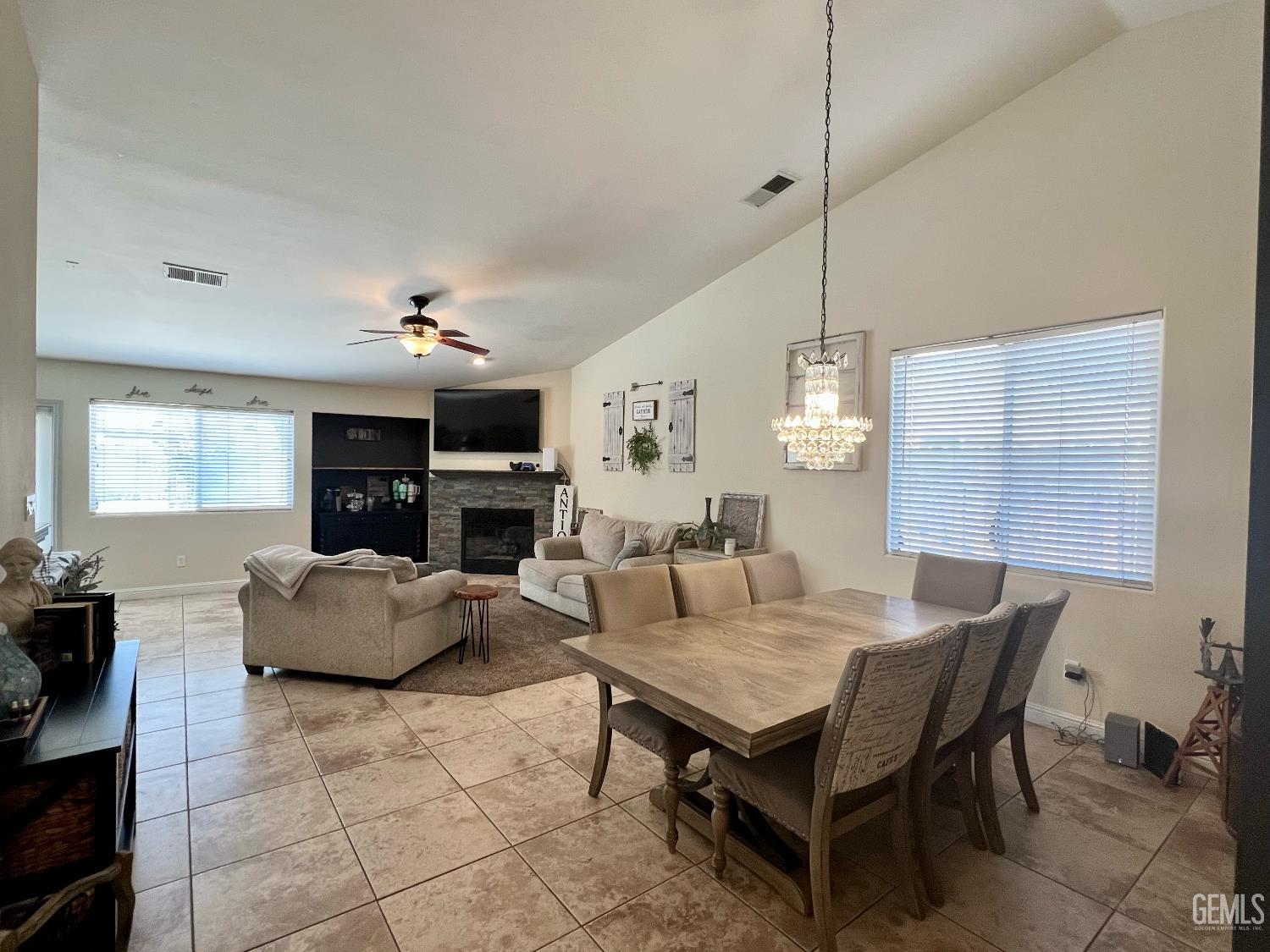 Undisclosed Address Bakersfield, CA 93312 - Photo 4 of 26 a living room with fireplace furniture and a wooden floor