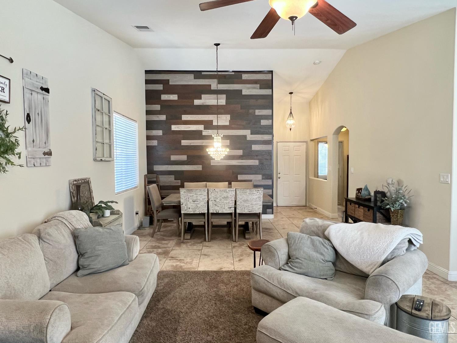 Undisclosed Address Bakersfield, CA 93312 - Photo 8 of 26 a living room with furniture kitchen view and a large window