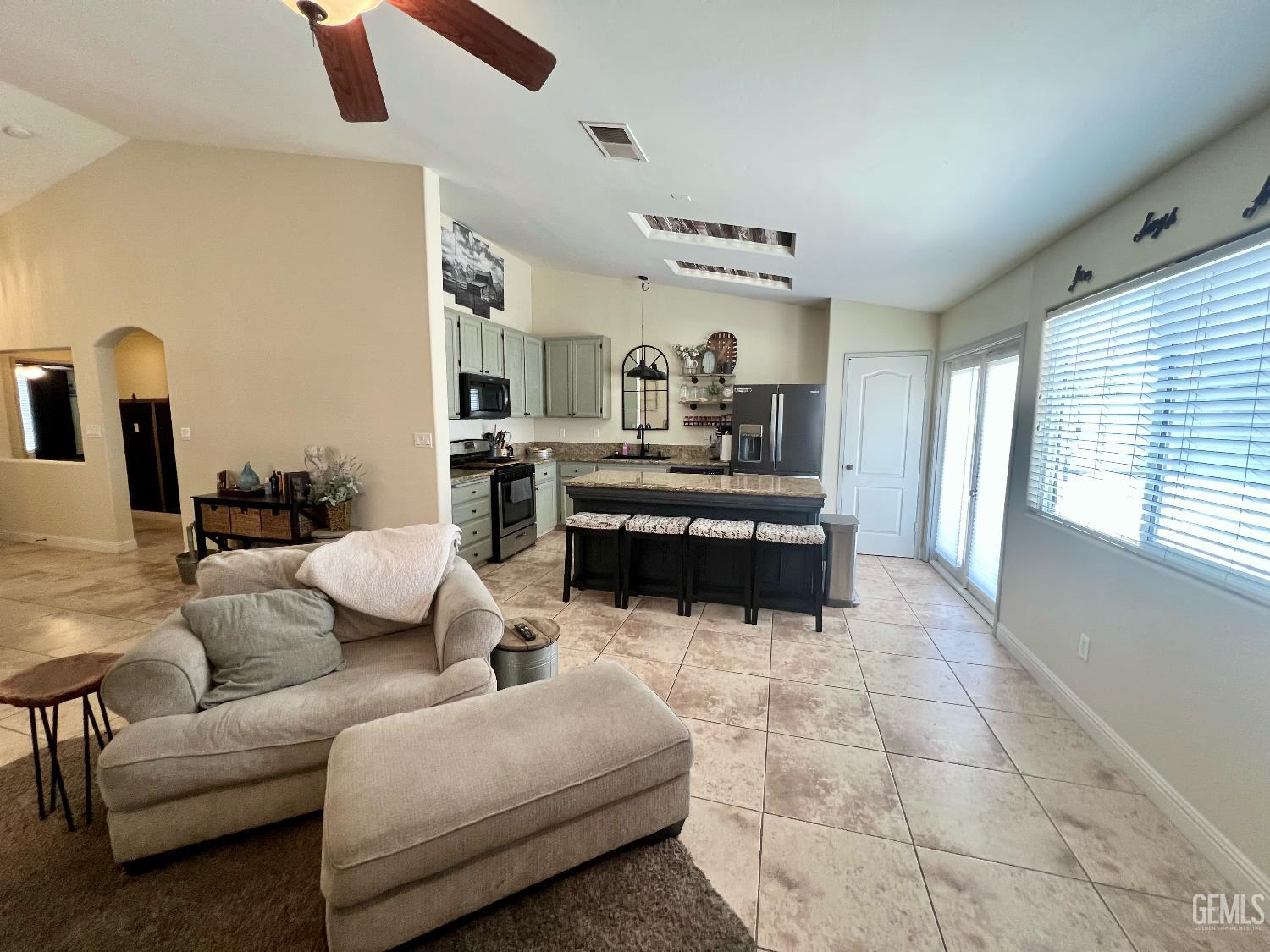 Undisclosed Address Bakersfield, CA 93312 - Photo 9 of 26 a living room with furniture and a large window