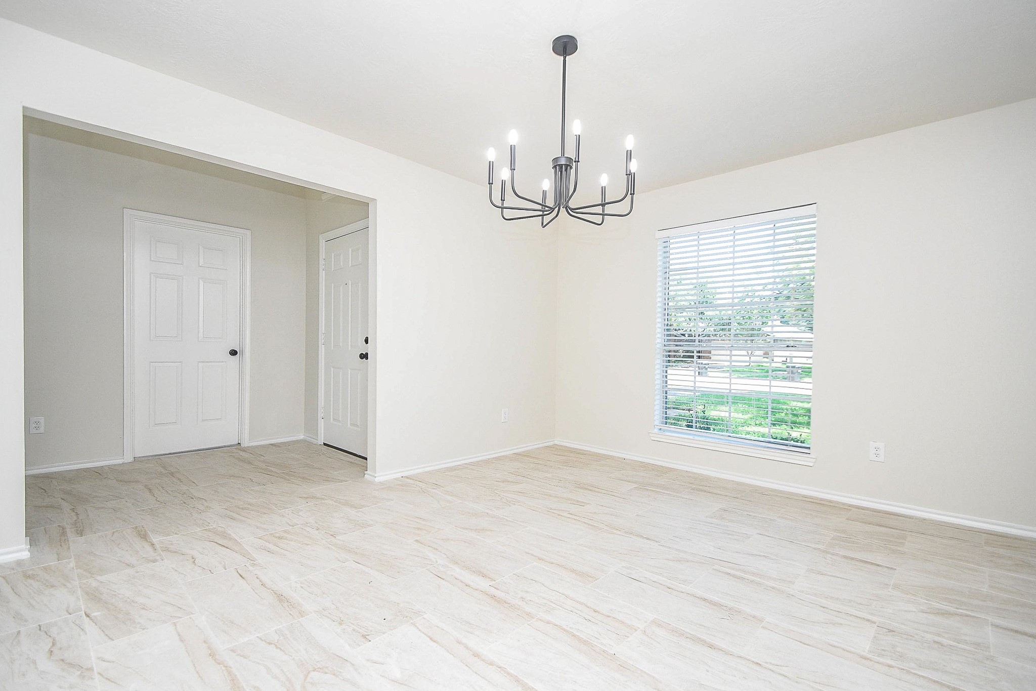 4810 Arbor Court Rosenberg, TX 77471 - Photo 3 of 20 a view of a livingroom with a chandelier wooden floor and chandelier