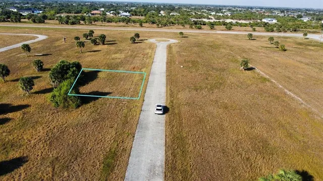 an aerial view of a house with a lake view