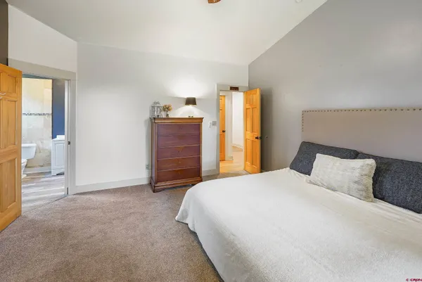 an aerial view of residential house with outdoor space and trees all around
