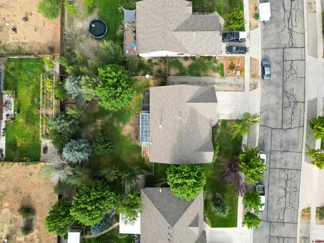 an aerial view of residential house with outdoor space and street view
