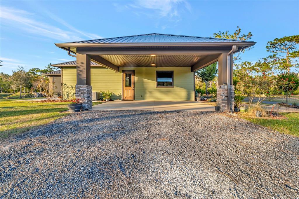7330 Crabgrass Road St. Cloud, FL 34773 - Photo 35 of 60 a view of a house with a yard