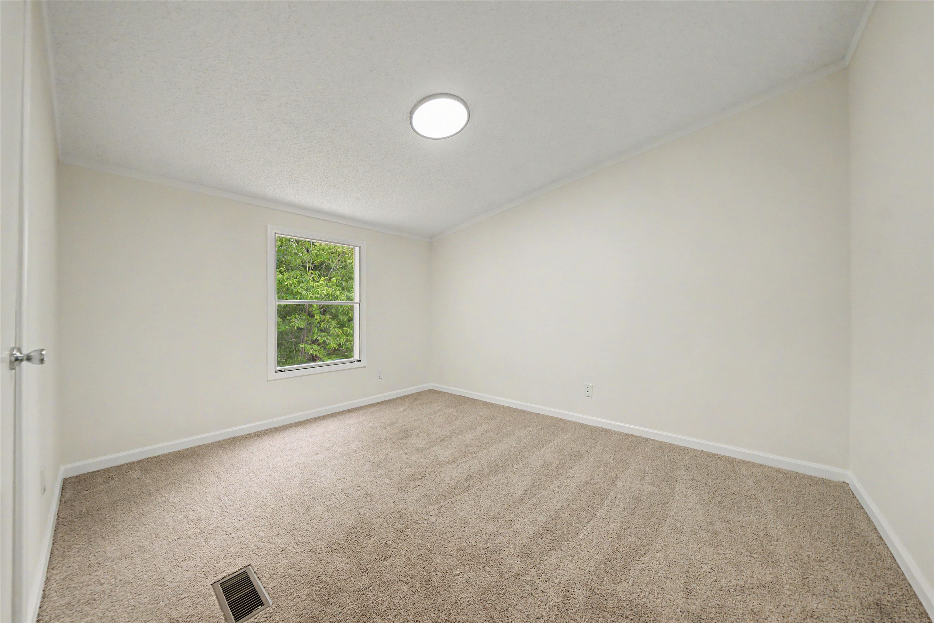 890 Burks Road Savannah, TN 38372 - Photo 19 of 40 an empty room with a window
