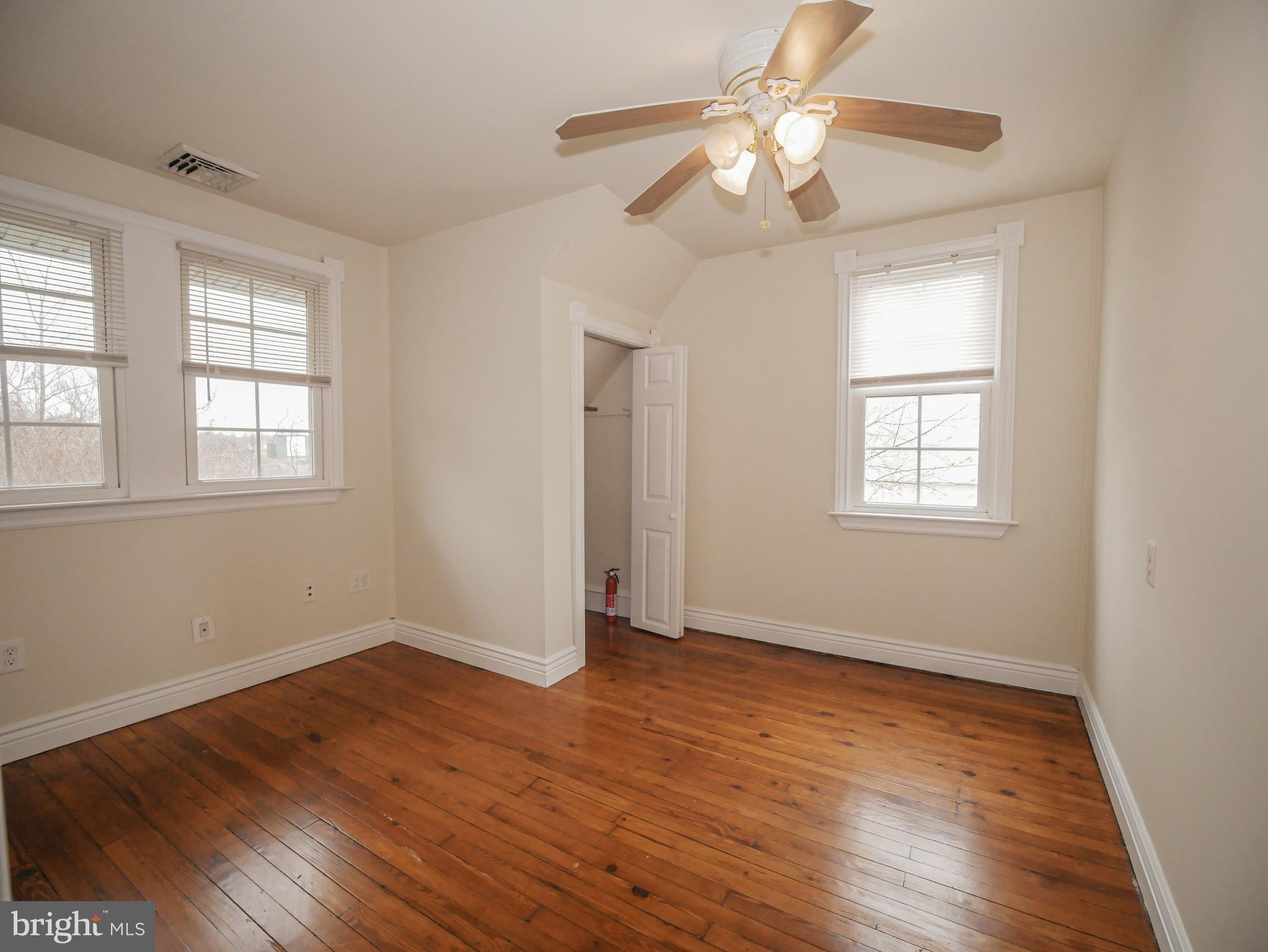 332 Crown Point Road Thorofare, NJ 08086 - Photo 34 of 36 a view of an empty room with wooden floor and a window
