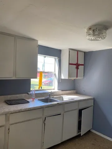 a kitchen with a stove and a sink