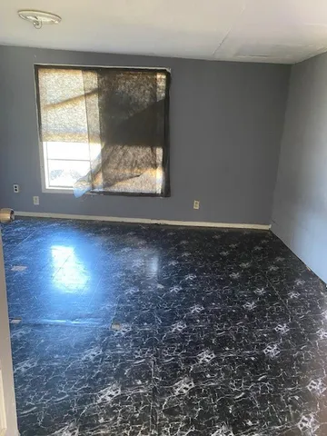 an empty room with windows