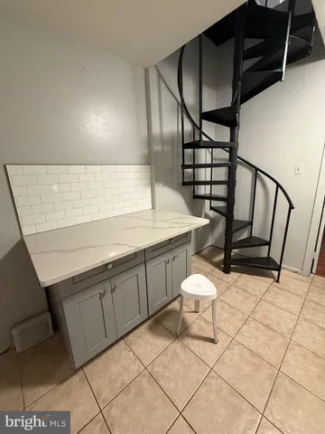 a bathroom with a sink toilet and mirror