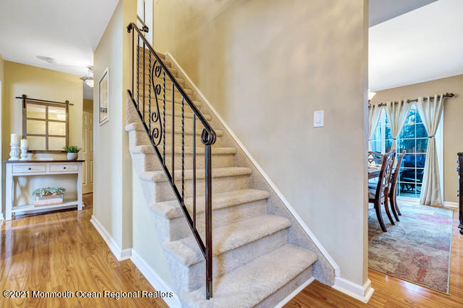 39 Kingsley Way Freehold, NJ 07728 - Photo 13 of 24 a view of entryway and hall with wooden floor