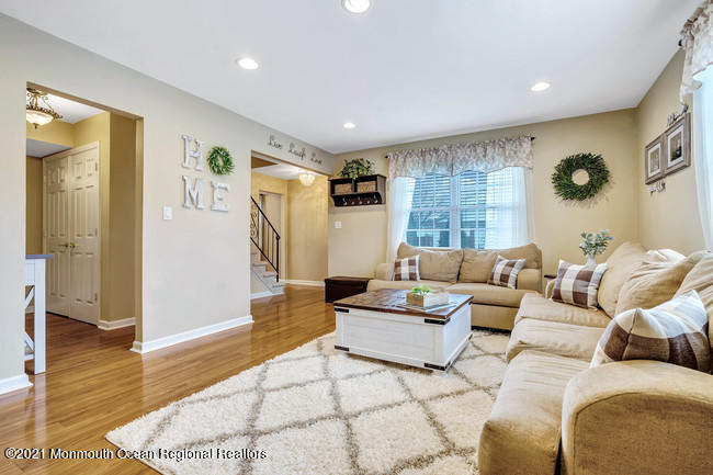 39 Kingsley Way Freehold, NJ 07728 - Photo 4 of 24 a living room with furniture and a wooden floor