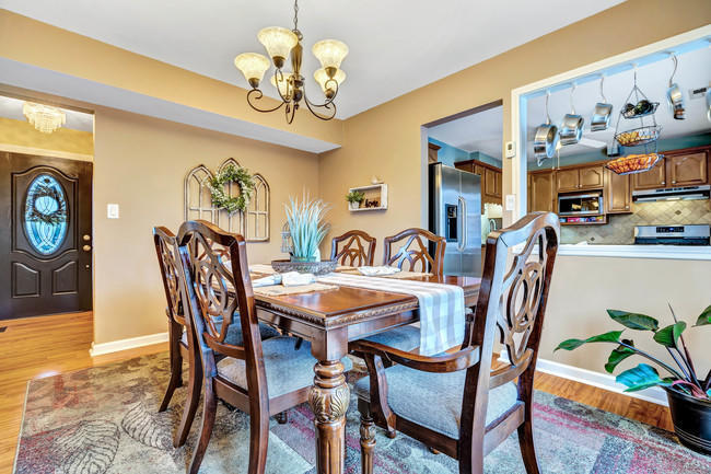 39 Kingsley Way Freehold, NJ 07728 - Photo 7 of 24 a view of a dining room with furniture and chandelier