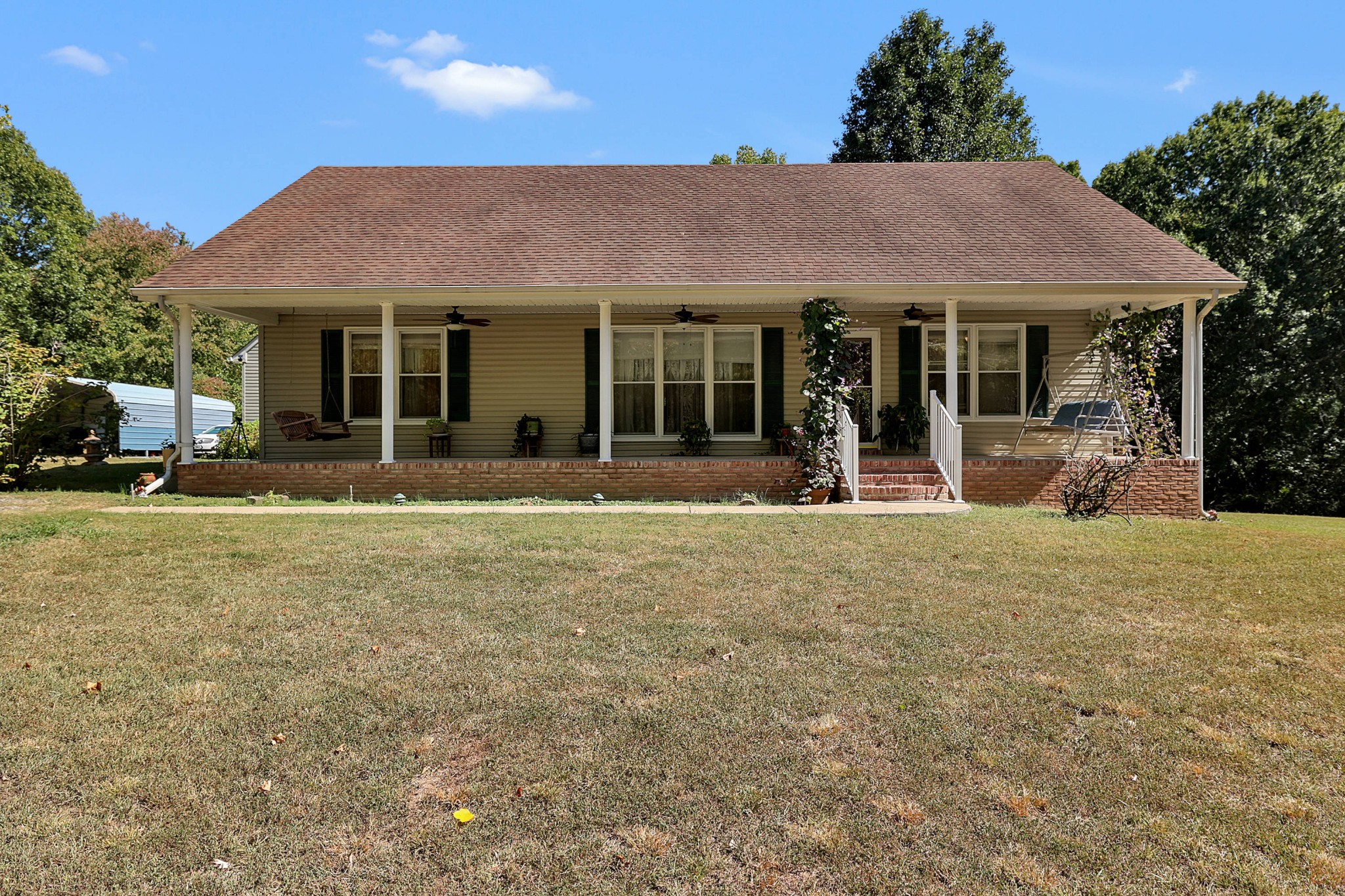 361 Harper Road Clarksville, TN 37043 - Photo 8 of 63 a front view of a house with a garden