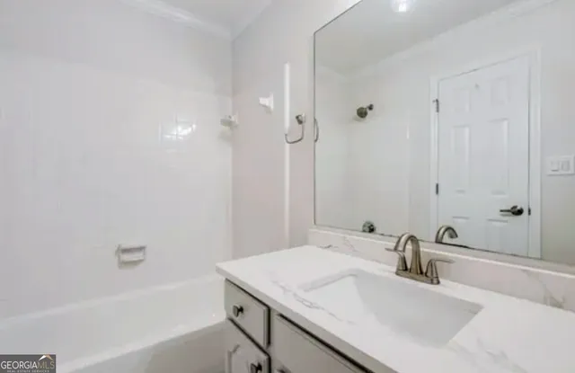 a bathroom with a sink and a bathtub
