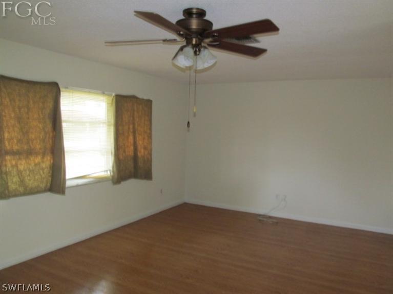 106 Georgia Road Lehigh Acres, FL 33936 - Photo 4 of 14 a view of empty room with window
