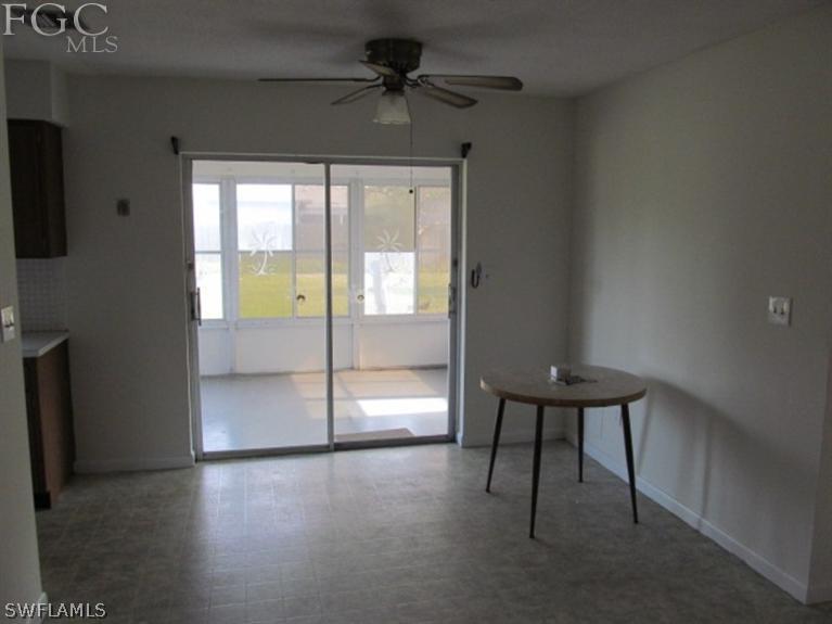 106 Georgia Road Lehigh Acres, FL 33936 - Photo 5 of 14 a view of an empty room with a window