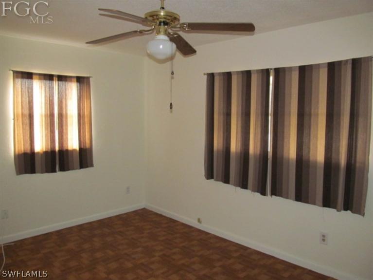 106 Georgia Road Lehigh Acres, FL 33936 - Photo 9 of 14 a view of a room with a window