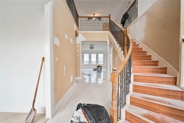 a view of entryway and hall with wooden floor