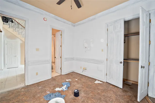 a living room with furniture and floor to ceiling window