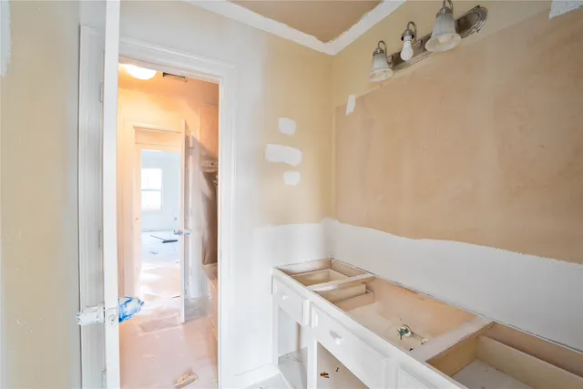a bathroom with a tub sink and vanity