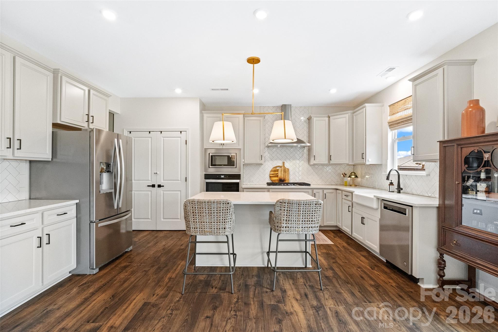 1350 Fishing Creek Road Clover, SC 29710 - Photo 13 of 47 a kitchen with white cabinets and stainless steel appliances