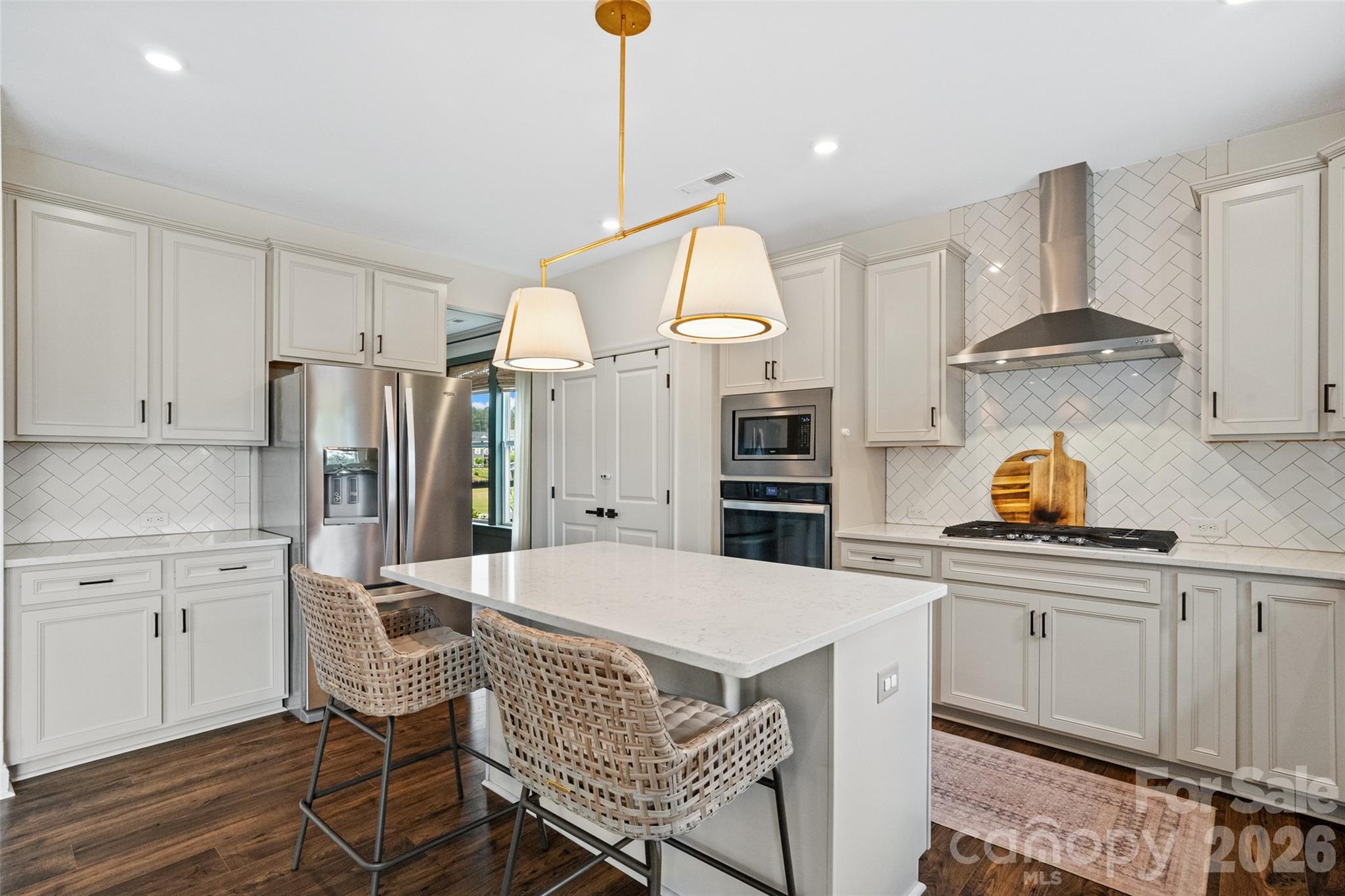 1350 Fishing Creek Road Clover, SC 29710 - Photo 14 of 47 a kitchen with stainless steel appliances a stove a sink refrigerator and cabinets