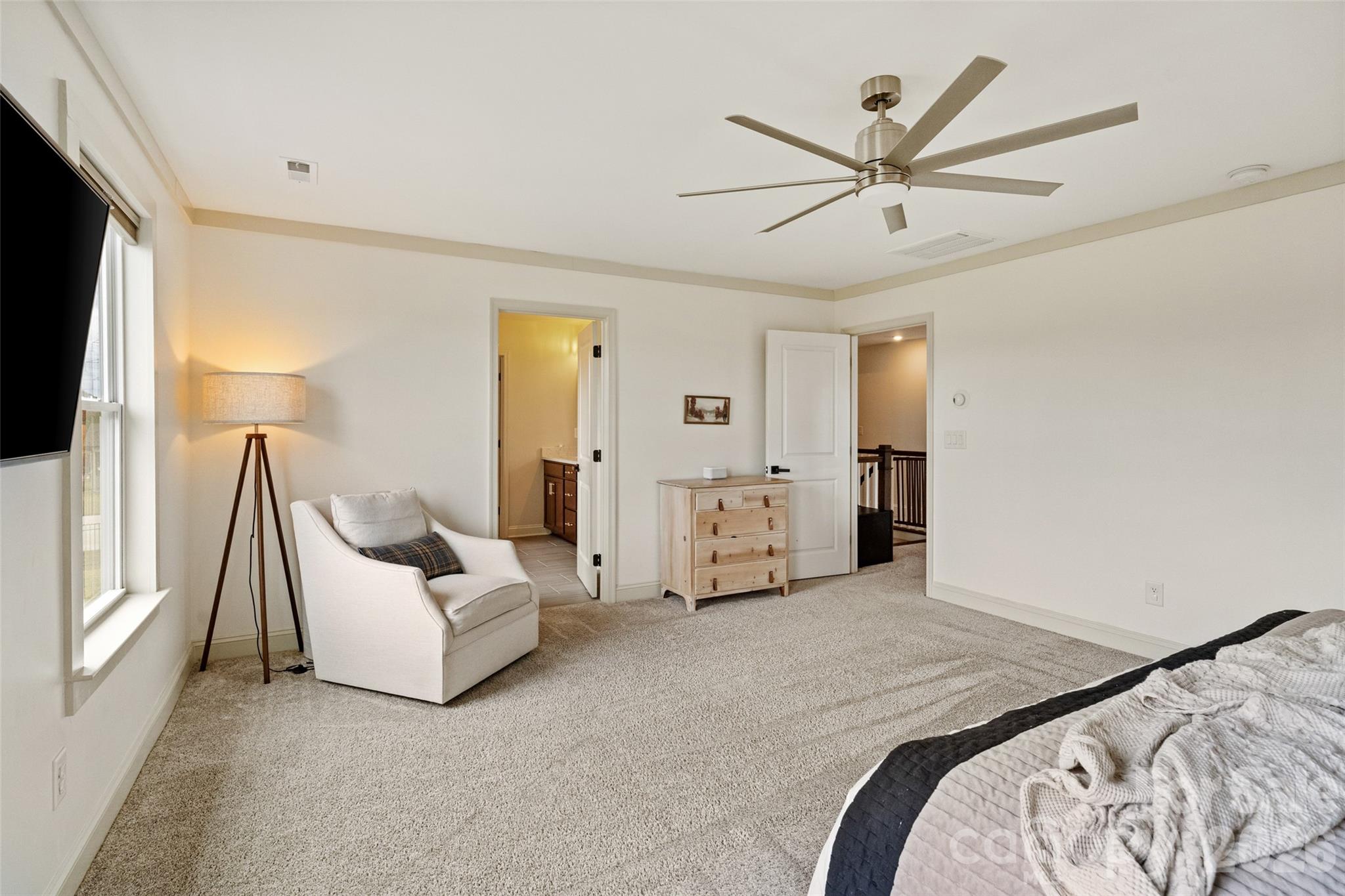1350 Fishing Creek Road Clover, SC 29710 - Photo 25 of 47 a spacious bedroom with a bed and a flat screen tv
