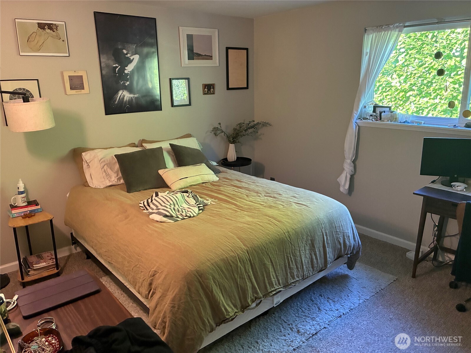 824 Northwest 64th Street Seattle, WA 98107 - Photo 4 of 7 a bed sitting in a bedroom next to a window