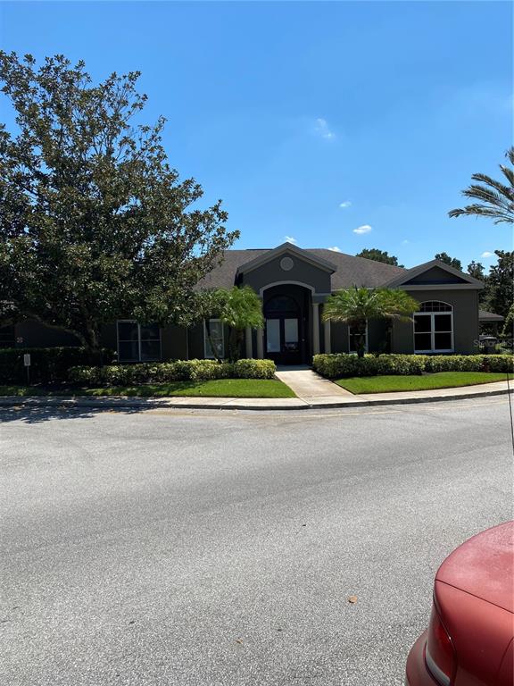 404 Summit Ridge Place, Unit 302 Longwood, FL 32779 - Photo 13 of 13 a swimming pool is sitting in front of a house