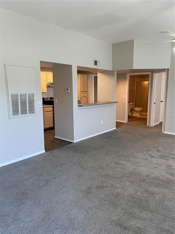 404 Summit Ridge Place, Unit 302 Longwood, FL 32779 - Photo 2 of 13 a view of an empty room with closet and windows