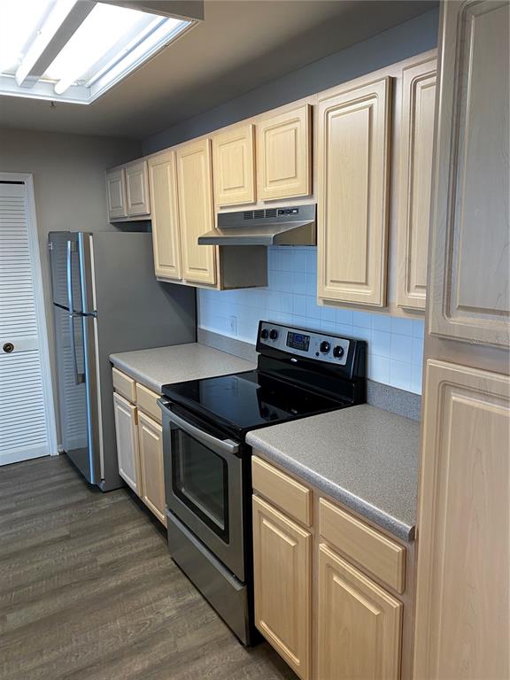404 Summit Ridge Place, Unit 302 Longwood, FL 32779 - Photo 3 of 13 a kitchen with granite countertop a sink stainless steel appliances and window