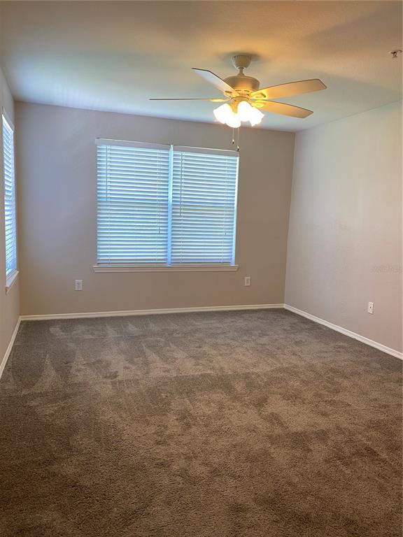 404 Summit Ridge Place, Unit 302 Longwood, FL 32779 - Photo 4 of 13 an empty room with a window