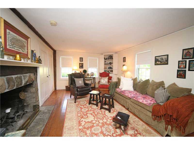 141 West Norwalk Road West Norwalk, CT 06850 - Photo 13 of 24 a living room with furniture a fireplace and a flat screen tv