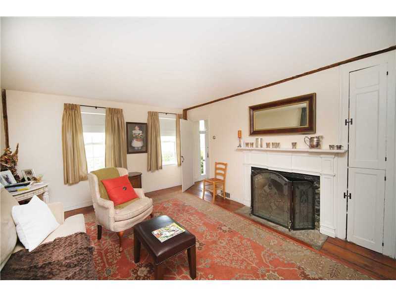 141 West Norwalk Road West Norwalk, CT 06850 - Photo 18 of 24 a living room with furniture a flat screen tv and a fireplace