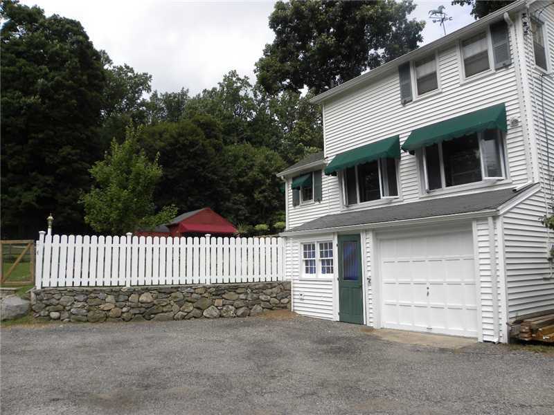 141 West Norwalk Road West Norwalk, CT 06850 - Photo 5 of 24 a front view of a house with a garden