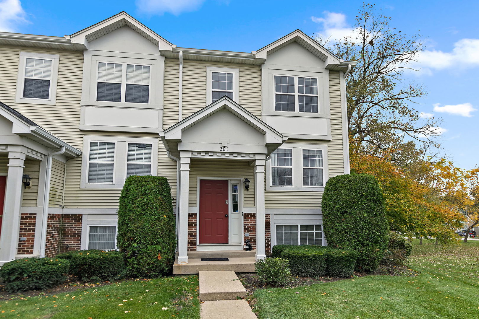 front view of a house with a yard