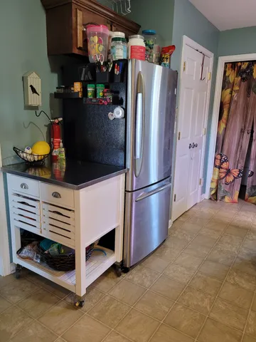 a bathroom with a sink vanity and a mirror