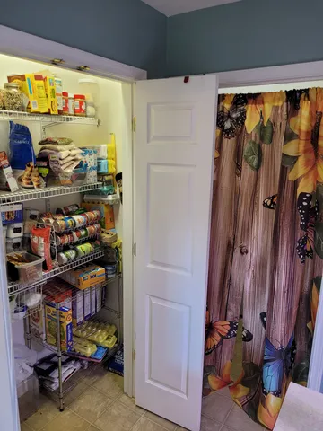 a bathroom with a bathtub a shower and a mirror