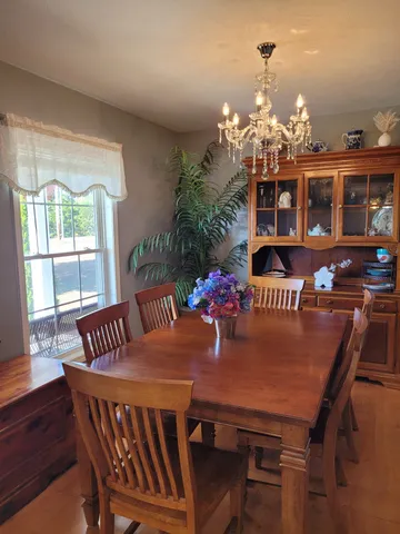 a view of a kitchen with a sink and a refrigerator
