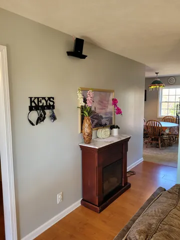 a view of a dining room with furniture and chandelier
