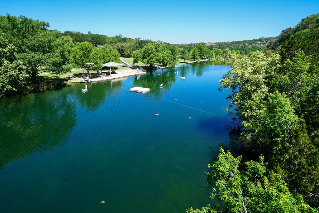 204 Wilson Ranch Road Hunt, TX 78024 - Photo 60 of 61 a view of lake background with residential house and outdoor space
